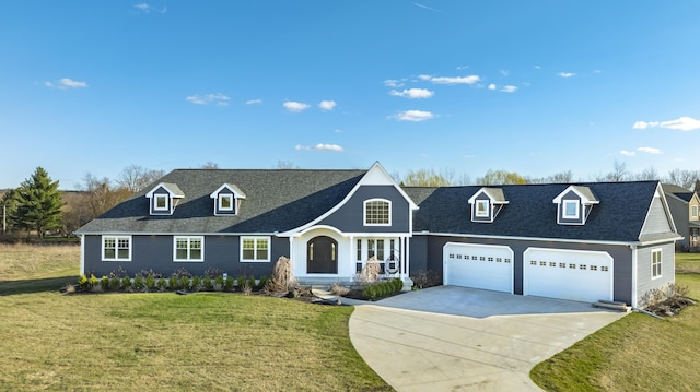 cape cod-style house featuring a garage, driveway, a front yard, and a shingled roof