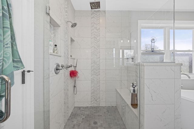 full bathroom featuring tiled shower