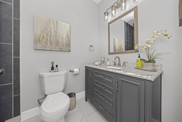 bathroom featuring baseboards, walk in shower, toilet, and vanity