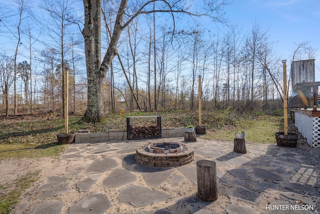 view of patio / terrace featuring a fire pit