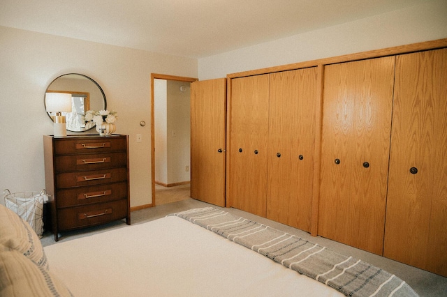 bedroom featuring light colored carpet