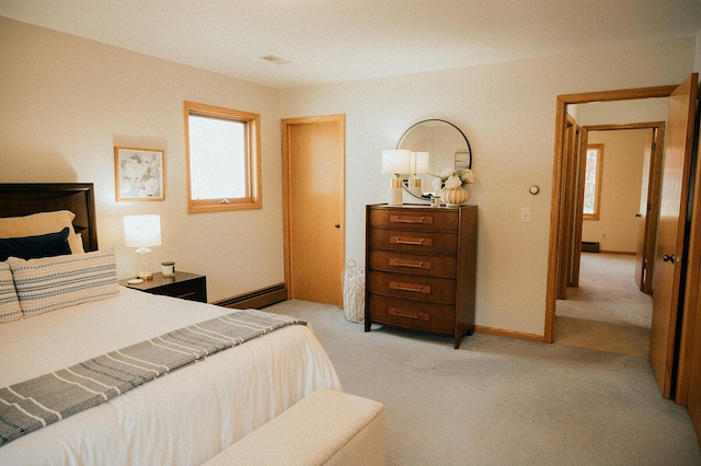 bedroom with baseboards, a baseboard radiator, multiple windows, and light carpet