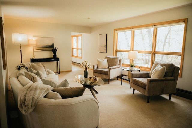 living area with light carpet and baseboard heating