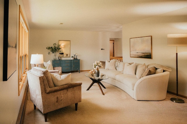 living room with baseboards and carpet