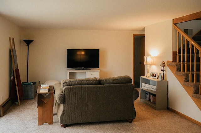 living area with stairs and light carpet