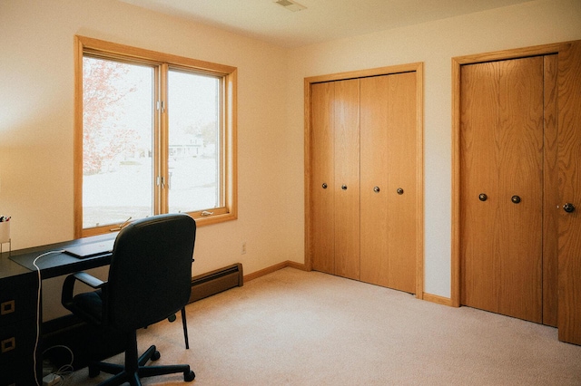 carpeted home office with baseboards