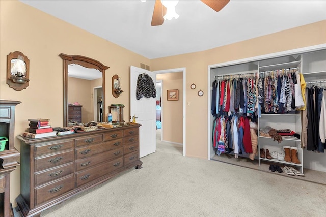 bedroom with carpet floors, ceiling fan, a closet, and visible vents