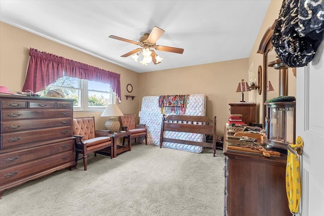 bedroom with a ceiling fan and light colored carpet