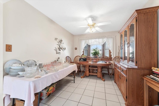 bedroom with a ceiling fan and light tile patterned floors