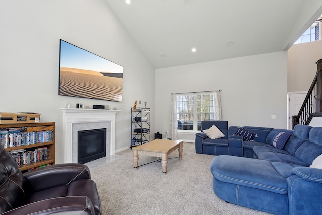living area with a fireplace, stairs, carpet floors, high vaulted ceiling, and recessed lighting