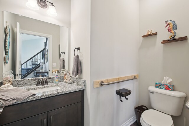 half bath with toilet and vanity