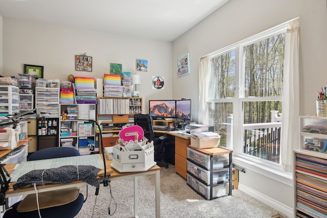 office area featuring plenty of natural light and carpet flooring