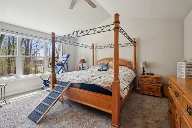 bedroom featuring carpet flooring, a ceiling fan, baseboards, and vaulted ceiling