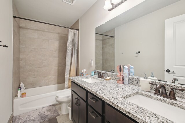 full bathroom with toilet, shower / bath combo, a sink, and tile patterned flooring