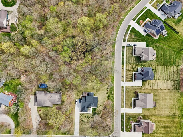 birds eye view of property with a residential view