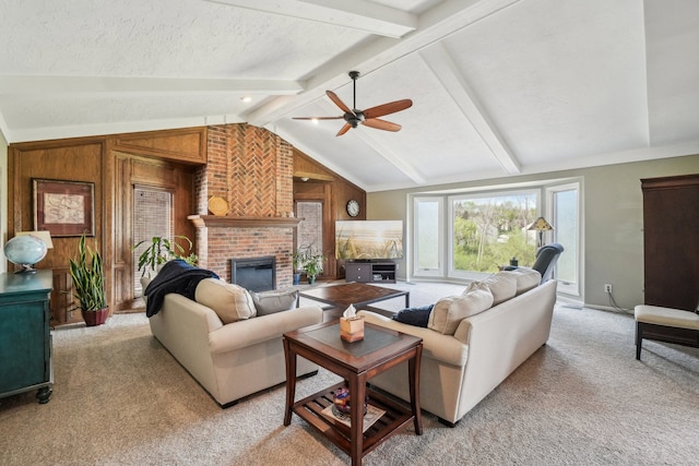 living room featuring a brick fireplace, light carpet, ceiling fan, wooden walls, and lofted ceiling with beams