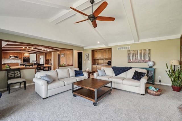 living area featuring a ceiling fan, visible vents, light carpet, and vaulted ceiling with beams