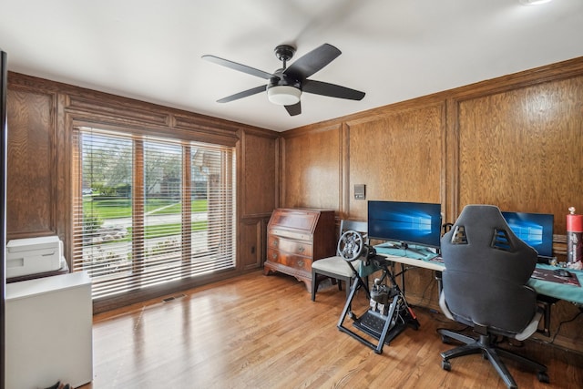 office with a ceiling fan and light wood-style floors