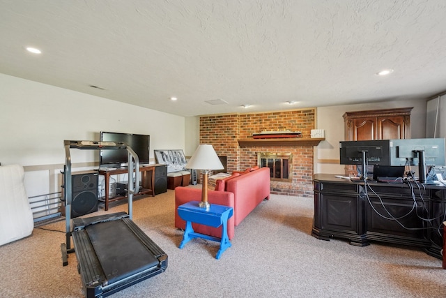 interior space with recessed lighting, a textured ceiling, a fireplace, and light carpet