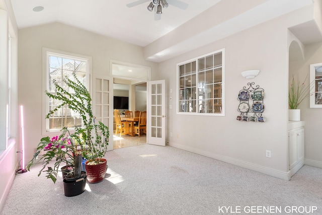 interior space featuring carpet flooring, ceiling fan, baseboards, and french doors