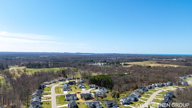 birds eye view of property featuring a view of trees and a residential view