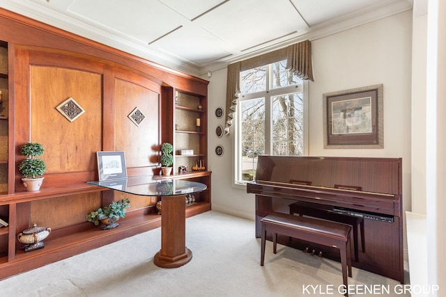 sitting room with crown molding, baseboards, and carpet