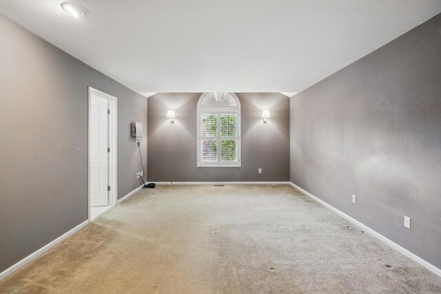 spare room with carpet floors and baseboards
