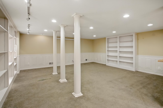 below grade area with visible vents, recessed lighting, carpet, and wainscoting