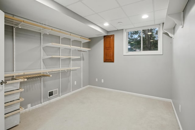 basement with baseboards, carpet flooring, recessed lighting, and visible vents