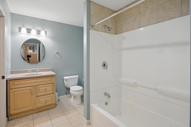 full bath with tile patterned flooring, vanity, toilet, baseboards, and bathtub / shower combination