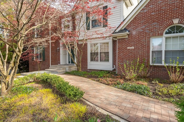 entrance to property with brick siding