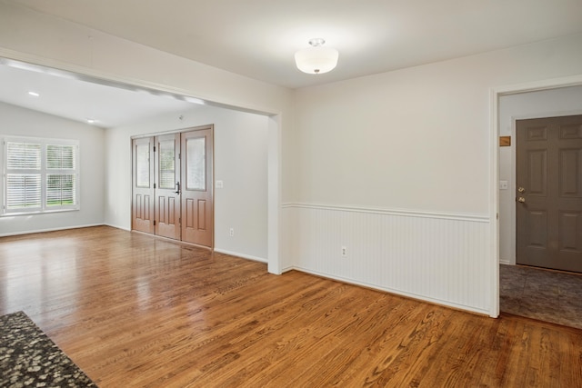 spare room with wood finished floors
