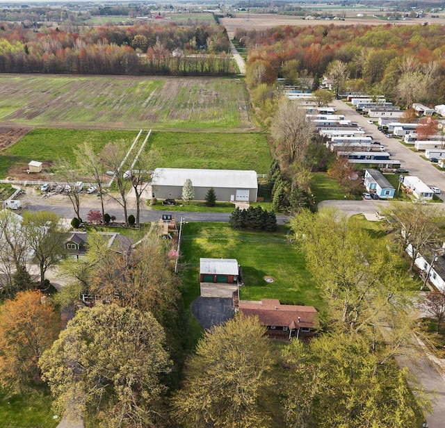 birds eye view of property with a rural view