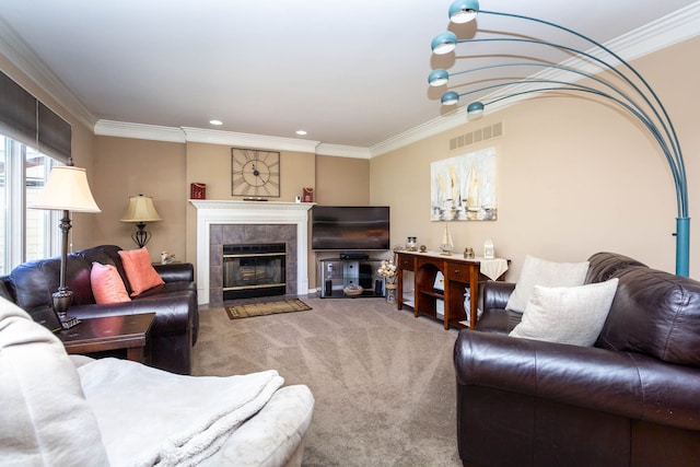 carpeted living room featuring visible vents, ornamental molding, recessed lighting, and a tile fireplace