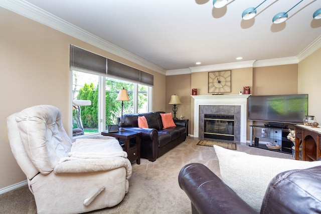 carpeted living room with crown molding, baseboards, and a tiled fireplace
