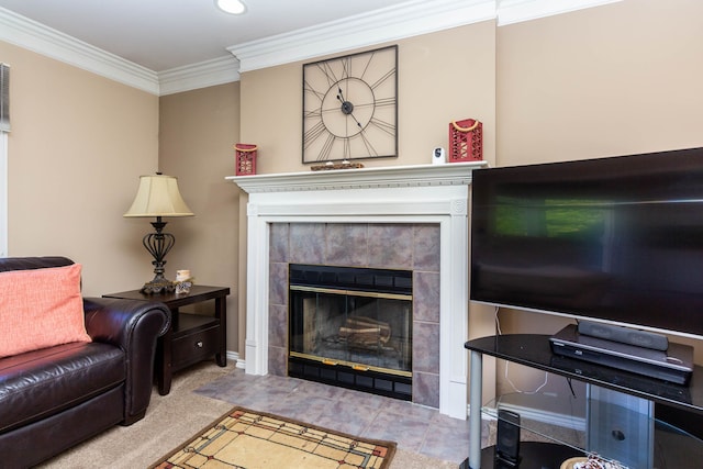 living area featuring crown molding, carpet, and a fireplace