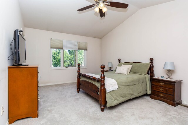 carpeted bedroom featuring baseboards, a ceiling fan, and lofted ceiling