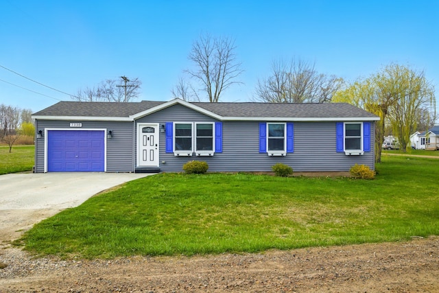 view of front of home with concrete driveway, roof with shingles, a front yard, and a garage