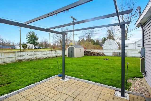 view of patio / terrace with a fenced backyard, an outbuilding, and a shed