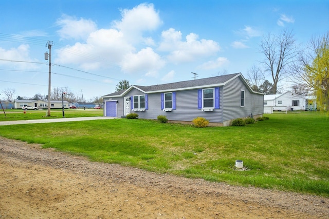 7330 Charlotte Rd, Lexington, MI 48450 - view of front of property featuring concrete driveway, a garage, and a front lawn