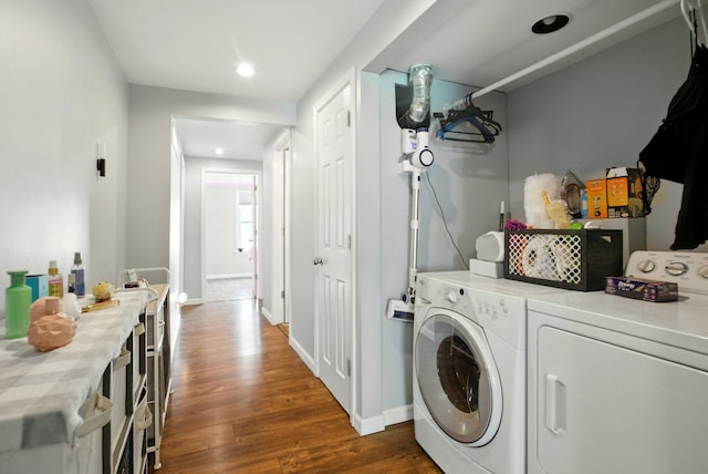 washroom featuring dark wood-type flooring, washer and clothes dryer, baseboards, and recessed lighting