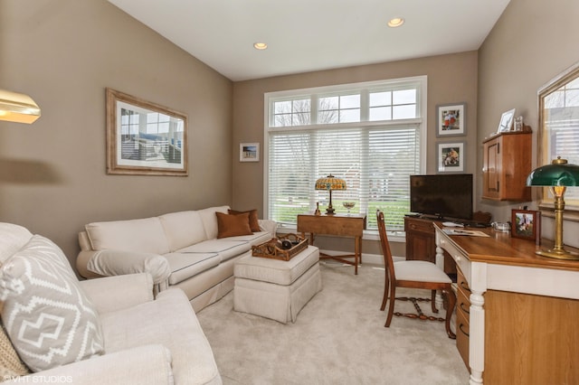 living room featuring light carpet and recessed lighting