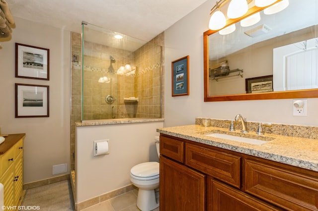 bathroom featuring vanity, visible vents, toilet, tiled shower, and tile patterned floors