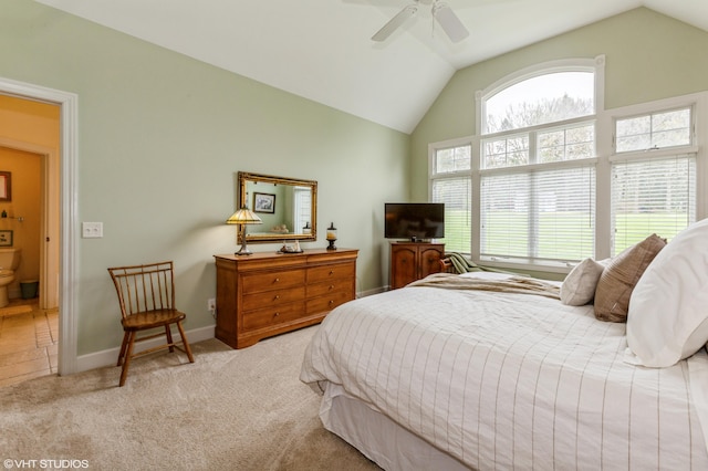 carpeted bedroom with a ceiling fan, baseboards, and lofted ceiling