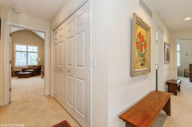 hallway featuring recessed lighting, visible vents, and carpet
