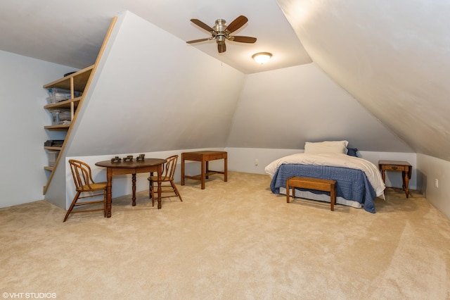 bedroom with carpet floors and lofted ceiling