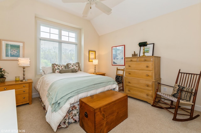 bedroom featuring ceiling fan, light colored carpet, and vaulted ceiling