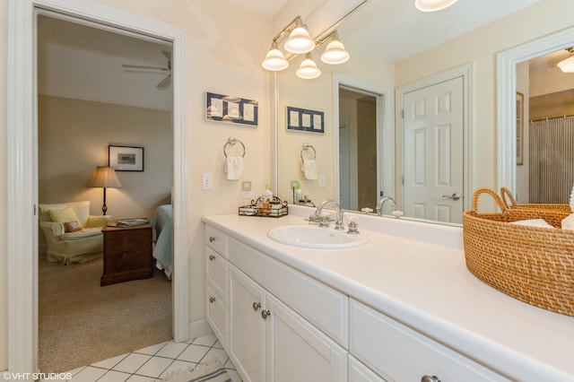 bathroom with vanity, tile patterned floors, and ensuite bath