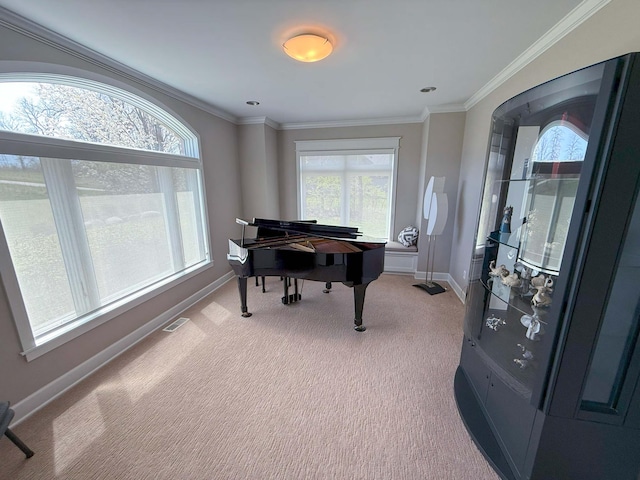 living area featuring baseboards, crown molding, visible vents, and light colored carpet