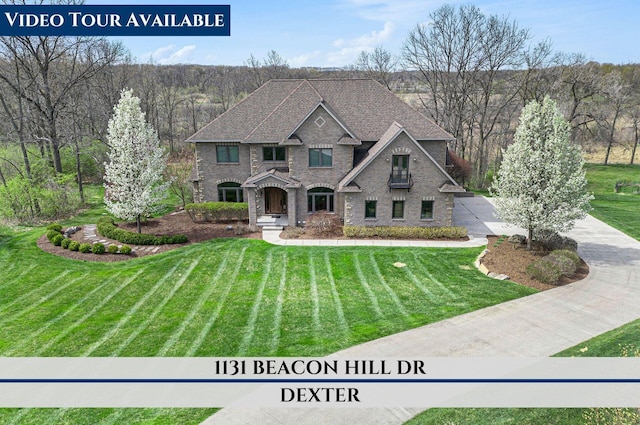 view of front of home with stone siding and a front yard